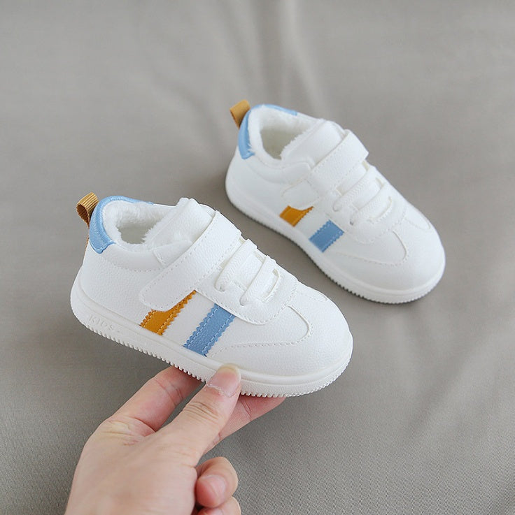 Little white Velcro baby shoes
